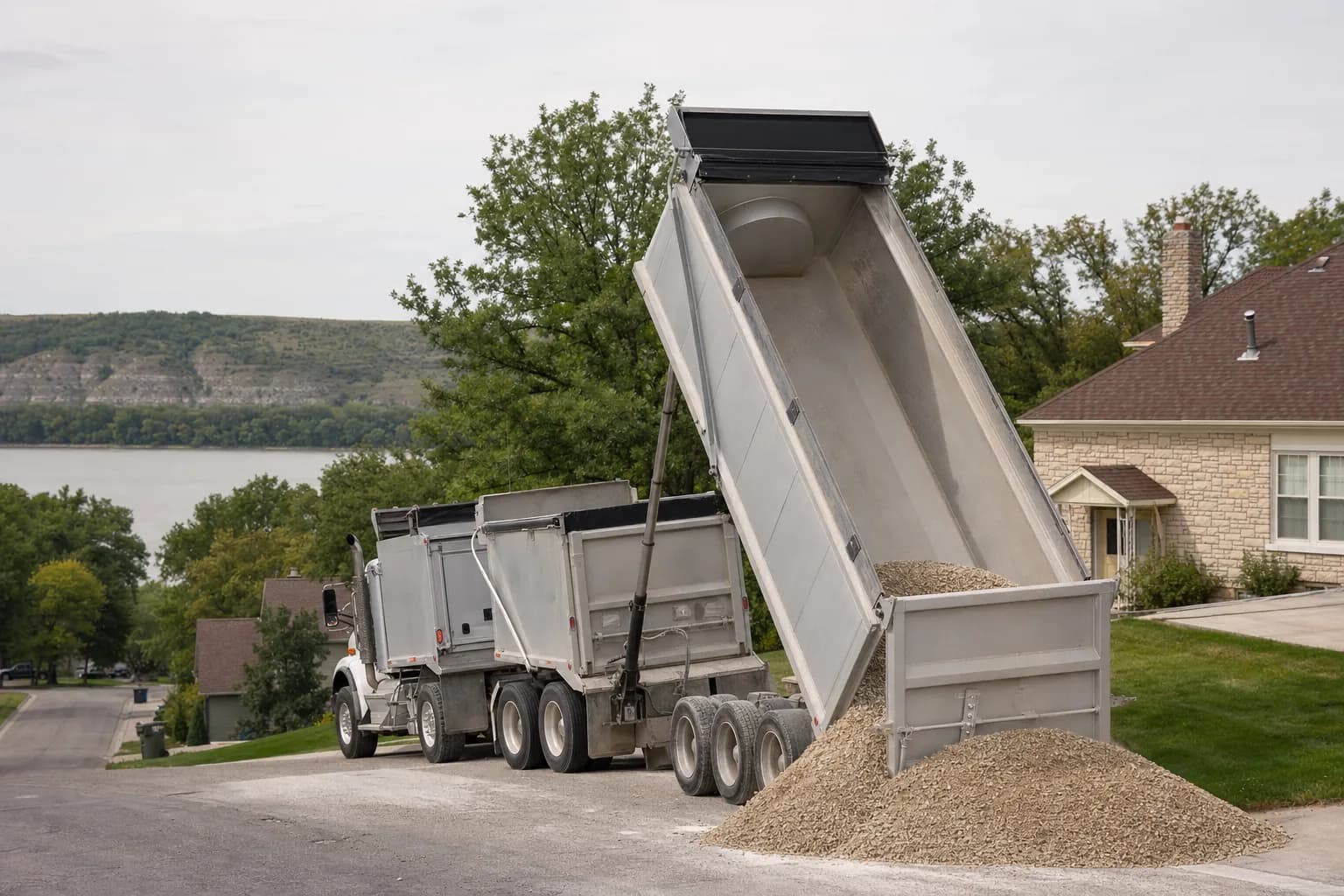 Dump truck delivering gravel